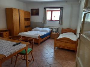Łóżko lub łóżka w pokoju w obiekcie Flamingo Apartman