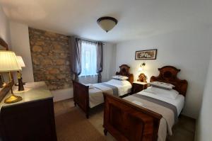 Posteľ alebo postele v izbe v ubytovaní Stone House Rosuja