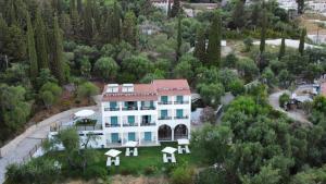 an aerial view of a house in a forest at Nikoli Apartments in Benitses