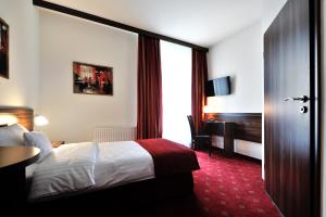 Posteľ alebo postele v izbe v ubytovaní Hotel Centrum Sosnowiec + 37 fotografií