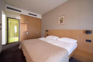 Postel nebo postele na pokoji v ubytování Terme Tuhelj Hotel Well