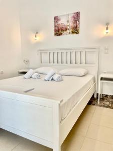 Ένα ή περισσότερα κρεβάτια σε δωμάτιο στο Casa Posidonia