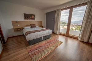 Voodi või voodid majutusasutuse Ayni Cusco Hotel toas +37 fotot