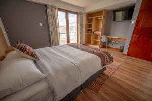 Katil atau katil-katil dalam bilik di Ayni Cusco Hotel