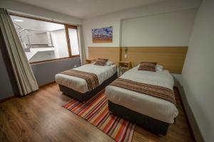 Katil atau katil-katil dalam bilik di Ayni Cusco Hotel