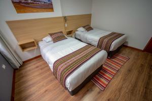 Katil atau katil-katil dalam bilik di Ayni Cusco Hotel