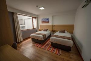 Katil atau katil-katil dalam bilik di Ayni Cusco Hotel