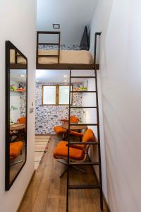 A bed or beds in a room at Premium Rooms by Hi5 - Style at the Comedy Theater