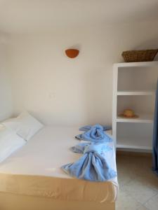 Postel nebo postele na pokoji v ubytování Madilida Sifnos Apartment