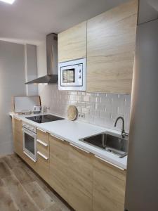 Kuchyňa alebo kuchynka v ubytovaní APARTAMENTO SH