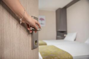 Postel nebo postele na pokoji v ubytování Eco Star Hotel