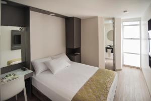 Postel nebo postele na pokoji v ubytování Eco Star Hotel