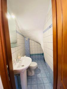 a bathroom with a sink and a toilet at Chrisa's Guest House in Skala Potamias +18 photos