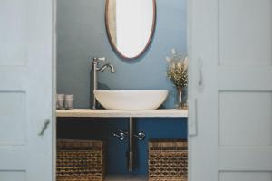 a bathroom with a sink and a mirror at Donna Elena - Epoque Residence in Asti