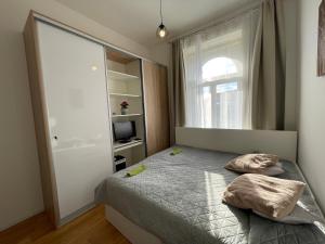 Postel nebo postele na pokoji v ubytování Luxurious studio Casa Royal Prague