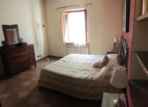 Ένα ή περισσότερα κρεβάτια σε δωμάτιο στο Casa degli Orti