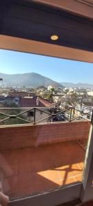 a view of a city from a window at depto salta dean funes in Salta