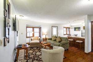 a living room with a couch and chairs and a table at Crown Resorts at Wolf Run in DuBois