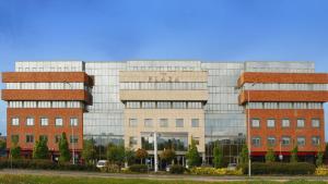 a large glass building with red brick at Plaza Hotel Tallaght in Tallaght