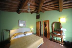 Postel nebo postele na pokoji v ubytování B&B Le Dimore Mezza Costa
