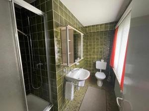 Vannas istaba naktsmītnē Hotel Restaurant Gommerhof