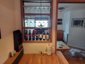 a room with a bunch of bottles of wine at Tórshavn City Apartment in Tórshavn