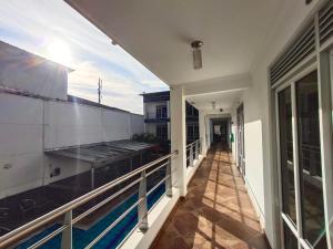 a balcony of a house with a swimming pool at Confort Plaza Hotel in Villavicencio