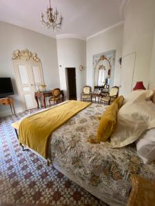a bedroom with a large bed and a mirror at Villa Rosa Béziers in Béziers +73 photos