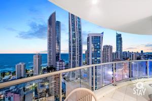 a balcony with a view of a city at Chevron Renaissance - QStay in Gold Coast