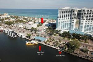 a view of a city with a boat in the water at Shell on the Beach 103 - RENOVATED in Hollywood +8 photos