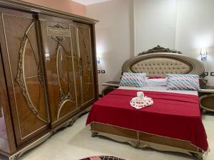 Cama o camas de una habitación en فندق نفرتيتى جمصه