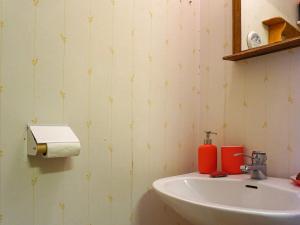 a bathroom with a sink and a toilet paper dispenser at 6 person holiday home in 38472-By Traum in Tillingenabben +55 photos