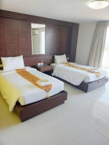 Cama o camas de una habitación en Convenient Grand Hotel