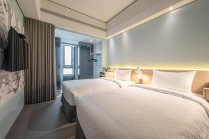 Postel nebo postele na pokoji v ubytování Ramble Hotel