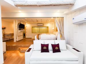 Postel nebo postele na pokoji v ubytování One Dhatu Ayutthaya Premium Homestay