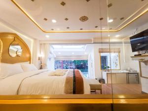 Postel nebo postele na pokoji v ubytování One Dhatu Ayutthaya Premium Homestay + 37 fotografií