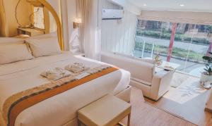Postel nebo postele na pokoji v ubytování One Dhatu Ayutthaya Premium Homestay
