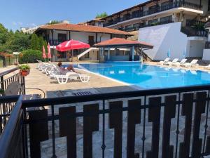 a view of a swimming pool on a balcony at Kavarna Paradise Apartments in Kavarna