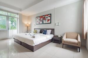 Postel nebo postele na pokoji v ubytování Urbanview Hotel Grand Malabar Bandung