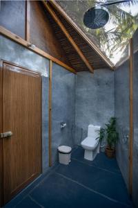 Kylpyhuone majoituspaikassa Goa Cottages Agonda