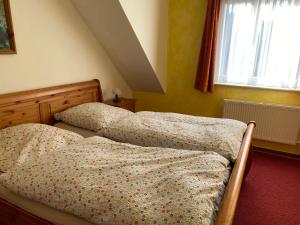 Posteľ alebo postele v izbe v ubytovaní Schwalbennest