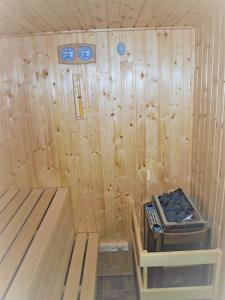 a inside of a sauna with a machine in it at Guest House LUFT Sněžník in Sněžnik