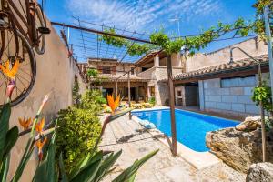 an image of a swimming pool in a house at Cal Tio in Sa Pobla