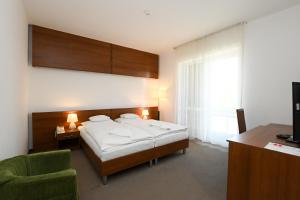 Postel nebo postele na pokoji v ubytování Hotel Kelep