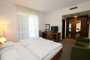 Postel nebo postele na pokoji v ubytování Hotel Kelep