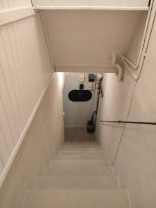 a stairway with a toilet in a room at La petite Arlésienne - Charmante maison de ville in Arles