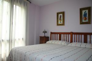 Giường trong phòng chung tại Casa de la abuela María