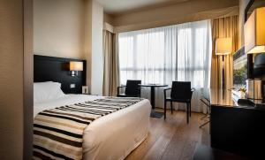 Postel nebo postele na pokoji v ubytování Sardegna Hotel - Suites & Restaurant