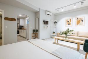 Łóżko lub łóżka w pokoju w obiekcie Guadalquivir Terrace Suite Apartments