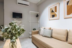 Telewizja i/lub zestaw kina domowego w obiekcie Guadalquivir Terrace Suite Apartments